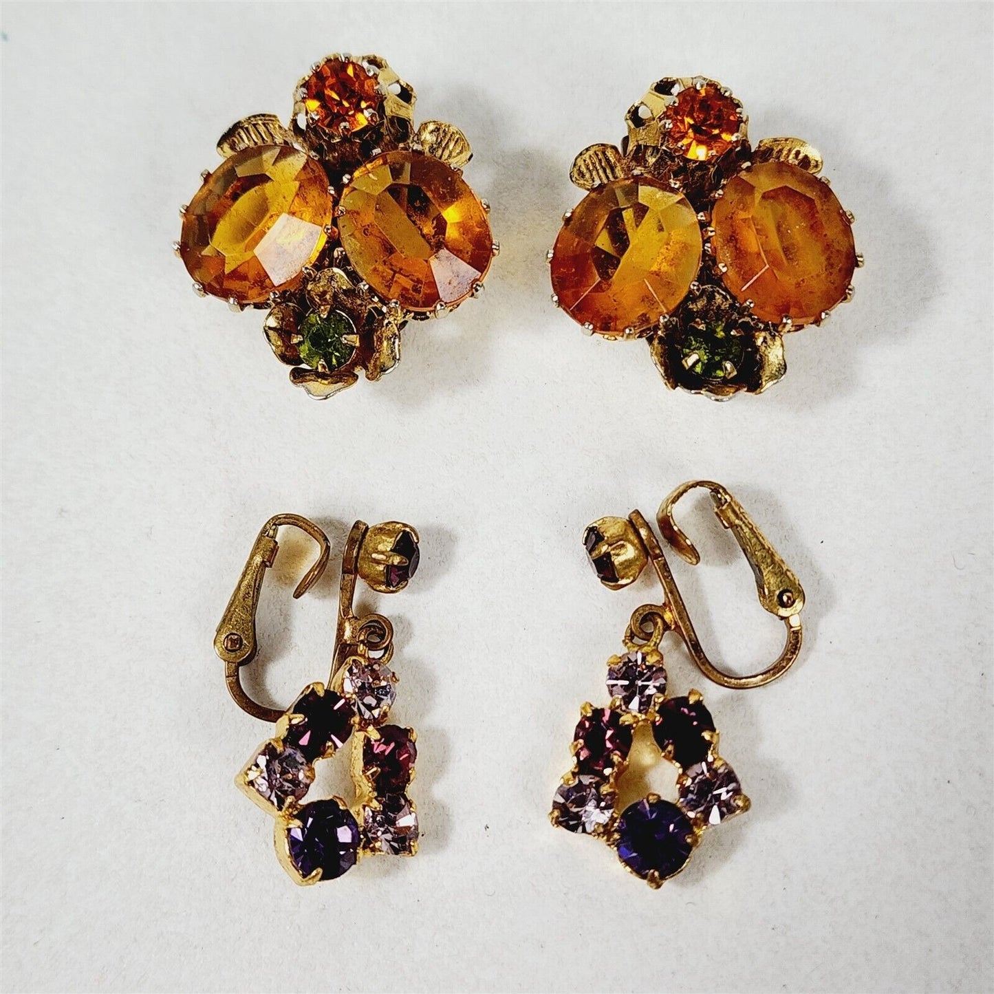 2 Pairs of Vintage Austria Marked Clip On Rhinestone Earrings Purple & Orange